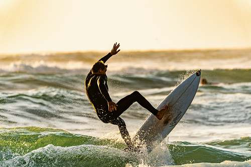 asilomar - conference center shallow focus photography of man surfing pacific grove
